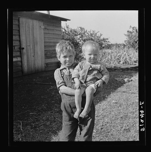 Near Belle Glade, Florida. Ten year old son of migrant packinghouse workers from Georgia. Mother is thirty-two years old, has had eleven children (two sets of twins) but only six living now. She lost her job in the packinghouse because they cut down on help after the "freeze-out"