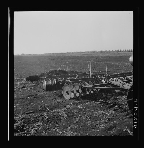 Untitled photo, possibly related to: Tractor-driven combination bean planter and fertilizer machine used on many large tracts of land in Florida farming area. Near Lake Okeechobee, Florida