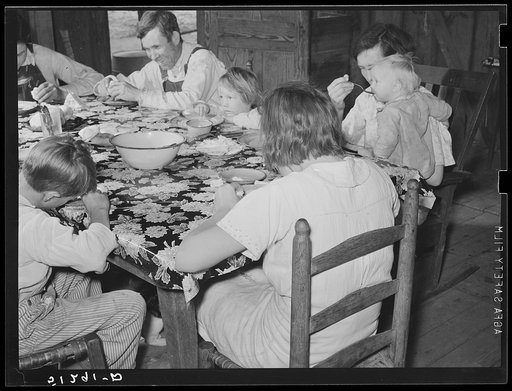 Untitled photo, possibly related to: Dinner of new rehabilitation family: biscuits, beans, and cake. Coffee County, Alabama