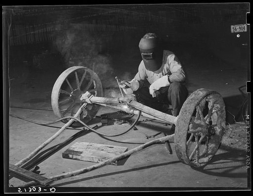 Welding axle. FSA (Farm Security Administration) warehouse depot. Atlanta, Georgia