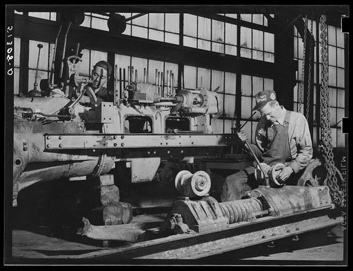 Repairing tractor. FSA (Farm Security Administration) warehouse depot. Atlanta, Georgia