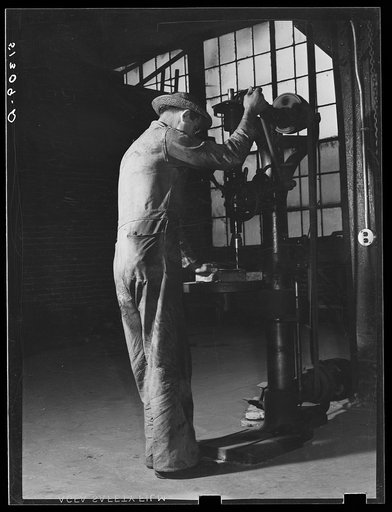 Untitled photo, possibly related to: Repairing automobile motor. FSA (Farm Security Administration) warehouse depot. Atlanta, Georgia