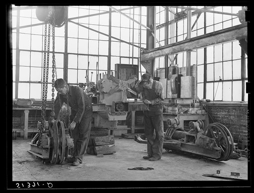 Repairing tractor. FSA (Farm Security Administration) warehouse depot. Atlanta, Georgia
