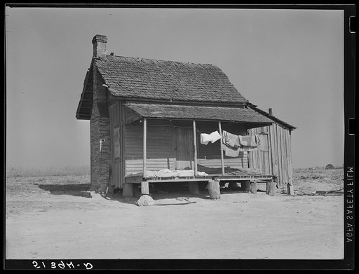 Typical old tenant's house with bedding being aired and sunned. Coffee County, Alabama