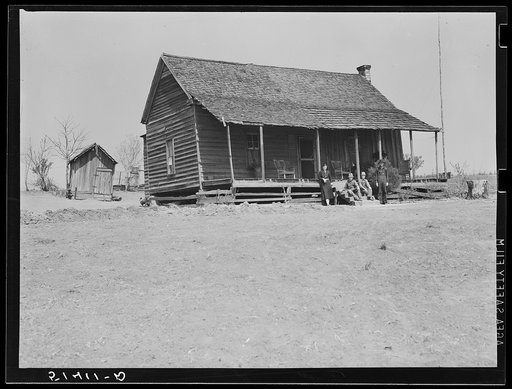 Mr. and Mrs. E.H. Wise, (R.R.-Rural Rehabilitation family) and their sons in front of home. Coffee County, Alabama