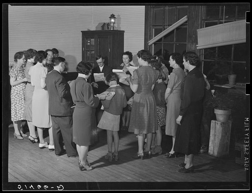Group singing during recreation evening at community school, under direction of WPA (Work Projects Administration) recreation supervisor. Coffee County, Alabama