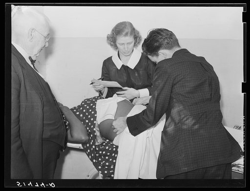 Doctor Lewis and Miss Teal, nurse, measuring patient's abdomen in prenatal clinic. Enterprise, Coffee County, Alabama