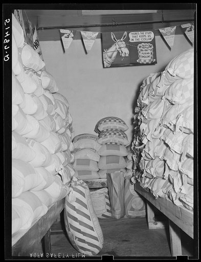 Stacks of supplies in farmers' exchange. Enterprise, Coffee County, Alabama