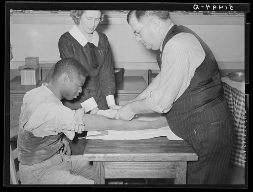 Miss Teal, nurse, and doctor W.R. Stanley giving treatment in veneral disease clinic. Enterprise, Coffee County, Alabama