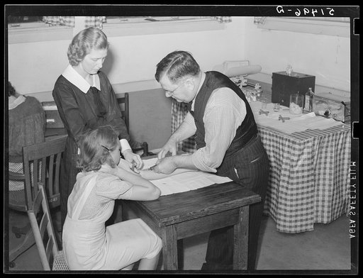 Miss Teal, nurse, and doctor W.R. Stanley giving young high school girl treatment in veneral disease clinic. Enterprise, Coffee County, Alabama