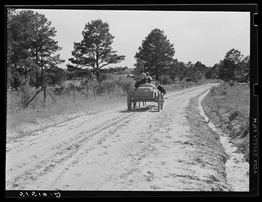 Bringing home feed and fertilizer from store. Gee's Bend, Alabama
