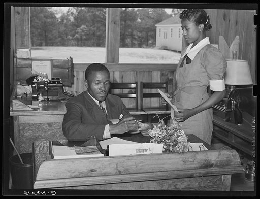 Students learn office and secretarial work by helping principal Robert Pierce. Gee's Bend, Alabama