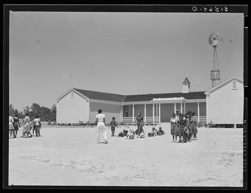 Florence Wright (in white slacks), recreation supervisor, directing games during outdoor period. Gee's Bend, Alabama