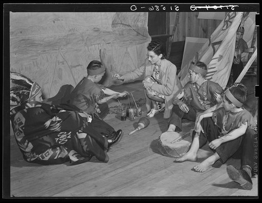 Fifty grade children being made up for play about Indians (which grew out of their regular class studies) on May Day-Health Day program. Ashwood Plantations, South Carolina