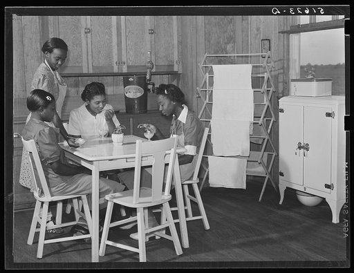 Beatrice Loftly, Lucy West, Miss. M.B.  Head, home economics teacher, and Josephine Daniels, in school home economics room enjoying ice cream they have made. Flint River Farms, Georgia