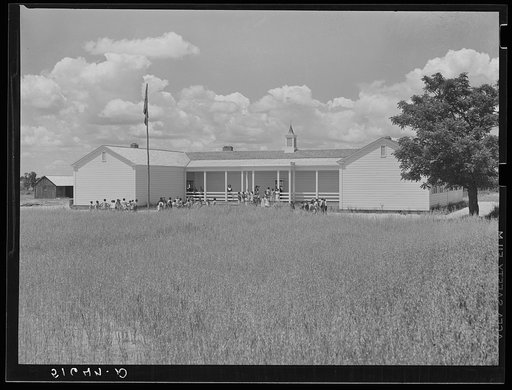 School building, with oats planted in foreground until landscaping can be done. Flint River Farms, Georgia