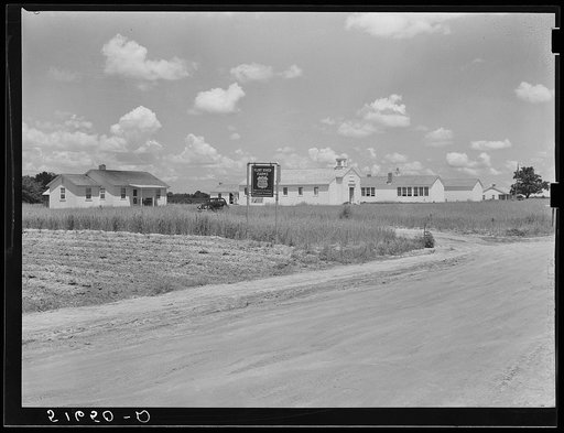 Teacherage, community, and school buildings before landscaping. Flint River Farms, Georgia