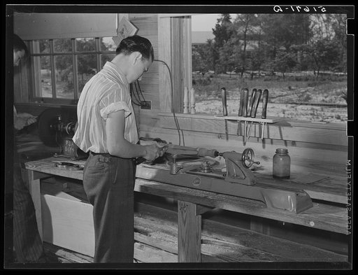 Clarence Haseldon turning lathe to make table leg in shop class. Ashwood Plantations school, South Carolina
