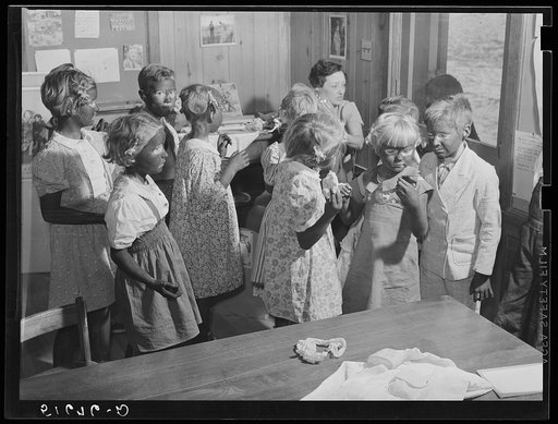 Second and third grade children being made up for their Negro song and dance at May Day-Health Day festivities. Ashwood Plantations, South Carolina