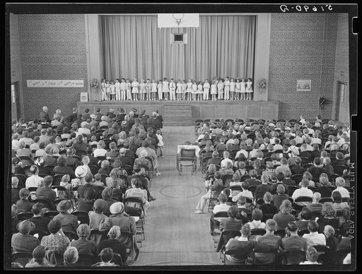 First grade children singing health song in May Day-Health Day program in auditorium. Ashwood Plantations, South Carolina