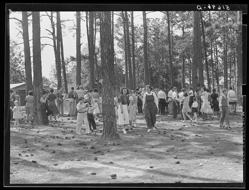 Project families, schoolchildren and guests enjoying barbecue sandwiches, hot dogs and coca colas, and ice cream after May Day-Health Day program. Irwinville Farms, Georgia