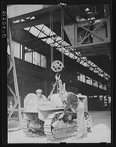 Untitled photo, possibly related to: Tractor is brought into repair shop in FSA (Farm Security Administration) warehouse depot by Shepard crane. Atlanta, Georgia