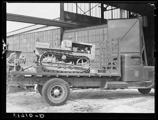 Untitled photo, possibly related to: Hooking shepard crane to tractor preparatory to hoisting it off truck to repairs shop in FSA (Farm Security Administration) warehouse depot. Atlanta, Georgia