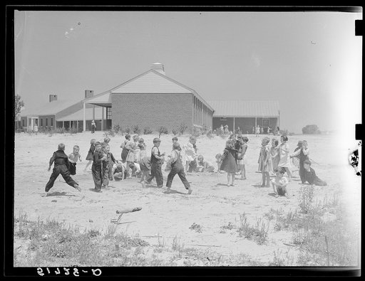 Second grade children playing near school building. Ashwood Plantations, South Carolina