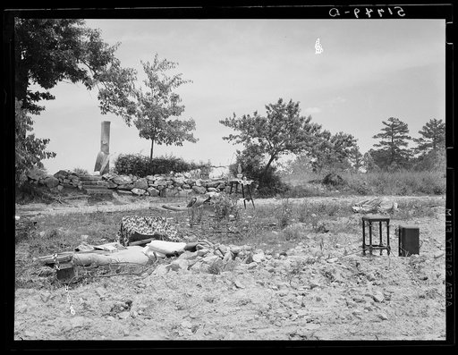 The remaining household goods after fire destroyed the home of a farm wagehand (day laborer, seventy-five cents per day) on a three acre piece of land owned by his mother. Greene County, Georgia
