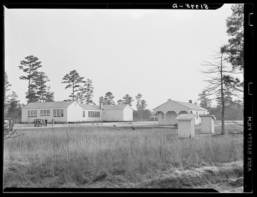 Community and school building, shop and sanitary units, rearview. Prairie Farms, Alabama