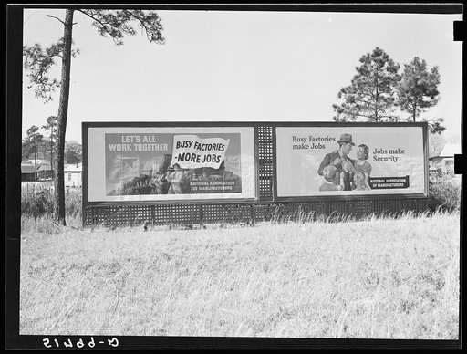Highway signs by lumber planing mill. Cairo, Georgia