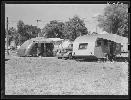 Untitled photo, possibly related to: Tourist camp, showing many modern trailers crowded together, some of the families remaining for weeks and months. Dade City, Florida