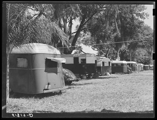 Tourist camp, showing many modern trailers crowded together, some of the families remaining for weeks and months. Dade City, Florida