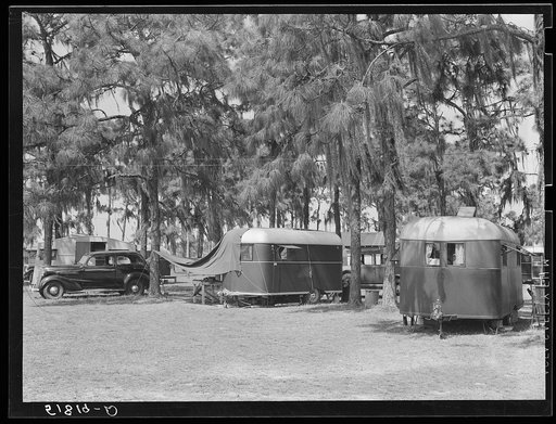 Untitled photo, possibly related to: Tourist camp, showing many modern trailers crowded together, some of the families remaining for weeks and months. Dade City, Florida