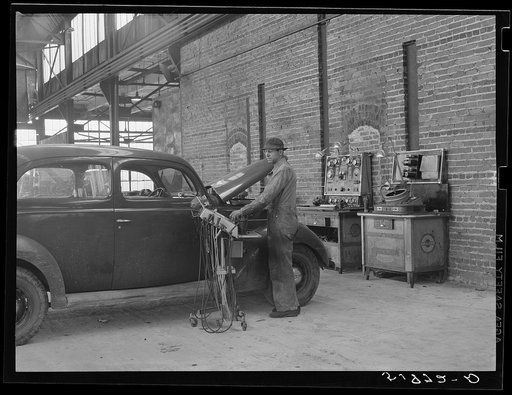 Untitled photo, possibly related to: Testing motors of car in FSA (Farm Security Administration) warehouse depot. Atlanta, Georgia
