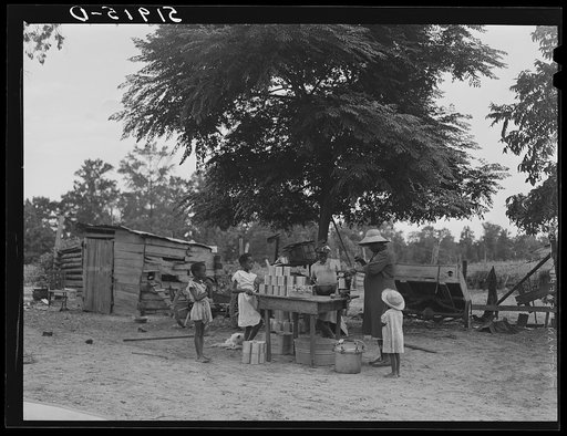 Untitled photo, possibly related to: Pauline Clyburn, rehabilitation client, and her children canning tomatoes. Manning, Clarendon County, South Carolina