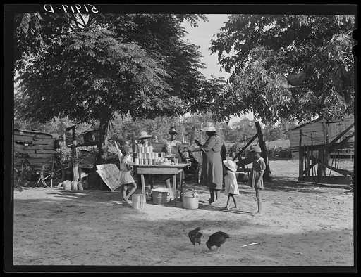 Pauline Clyburn, rehabilitation client, and her children canning tomatoes. Manning, Clarendon County, South Carolina