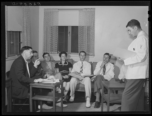 Untitled photo, possibly related to: Doctor reading paper to members of board of directors of Greenbelt, Maryland medical association