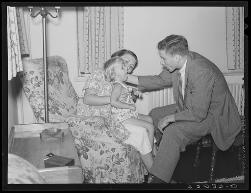 Doctor examining child in home. Greenbelt, Maryland