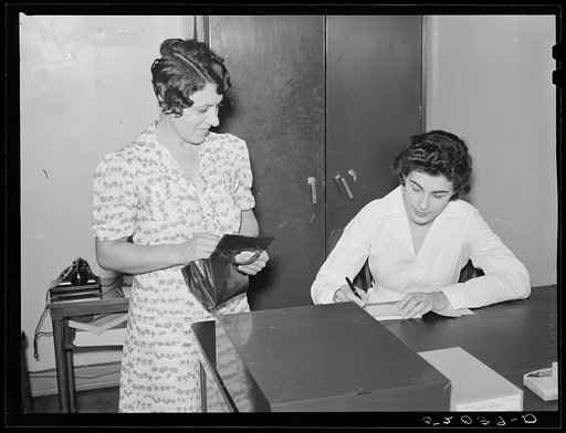 Woman making application for membership in Greenbelt medical association
