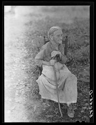 Mrs. Lloyd, ninety-one year-old victim of pellagra, mother of Miss Nettie Lloyd, was born and reared in Orange County and has lived on this spot since her marriage sixty-nine years ago. This is the road leading off from left of Route 54 about four miles west of Carboro. Orange County, North Carolina