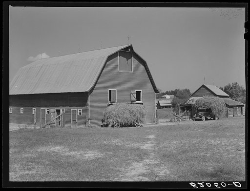Stock barn with wagon and truck of hay on a very prosperous farm, over 600 acres, belonging to a Negro, B.C. Corbett. This is a Negro settlement. Near Carr, in Orange County, North Carolina