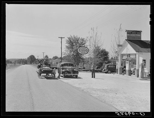 Combination filling station, garage, blacksmith shop, grocery store. Frank Petty, owner of the wagon, has just had his mule shod, his corn ground, purchases some kerosene and is returning home.  R.F.D. Danville, Virginia, Pittsylvania County