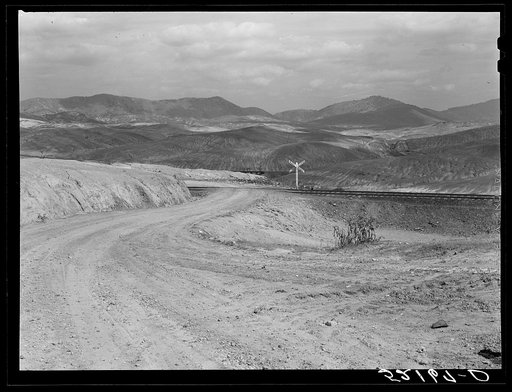 Untitled photo, possibly related to: Train bringing copper ore out of mine. Ducktown, Tennessee. Fumes from smelting copper for sulfuric acid have destroyed all vegetation and eroded the land