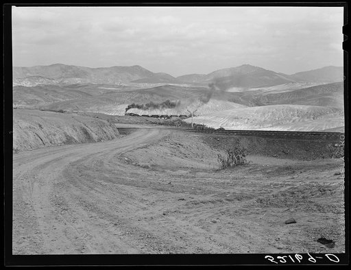 Train bringing copper ore out of mine. Ducktown, Tennessee. Fumes from smelting copper for sulfuric acid have destroyed all vegetation and eroded the land
