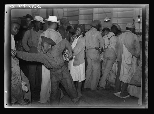 Untitled photo, possibly related to: Negro day laborers brought in truck from nearby towns, waiting to be paid off for cotton picking and buy supplies inside plantation store on Friday night. Marcella Plantation. Mississippi Delta. Mississippi