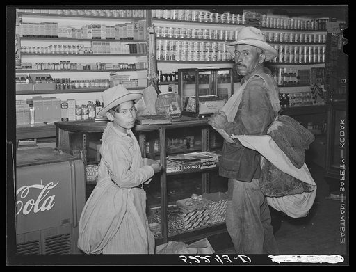 Untitled photo, possibly related to: Mexican cotton pickers inside plantation store. Knowlton Plantation, Perthshire, Mississippi Delta. This transient labor is contracted for and brought in trucks from Texas each season