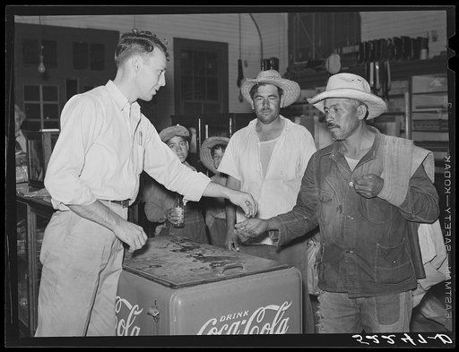 Mexican cotton pickers inside plantation store. Knowlton Plantation, Perthshire, Mississippi Delta. This transient labor is contracted for and brought in trucks from Texas each season. Mississippi Delta, Mississippi