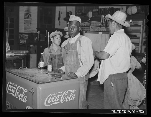 Mexican and Negro cotton pickers inside plantation store, Knowlton Plantation, Perthshire, Mississippi Delta. This transient labor is contracted for and brought in from Texas each season
