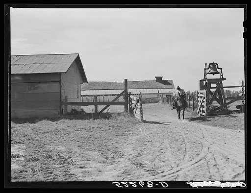 Old plantation bell and barn on Clover Hill Plantation near Clarksdale, Mississippi Delta, Mississippi